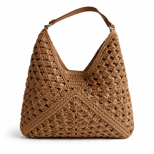 Detail of slouchy hobo crochet bag showing open lattice lacework and silver-tone hardware — MOUJ Egypt